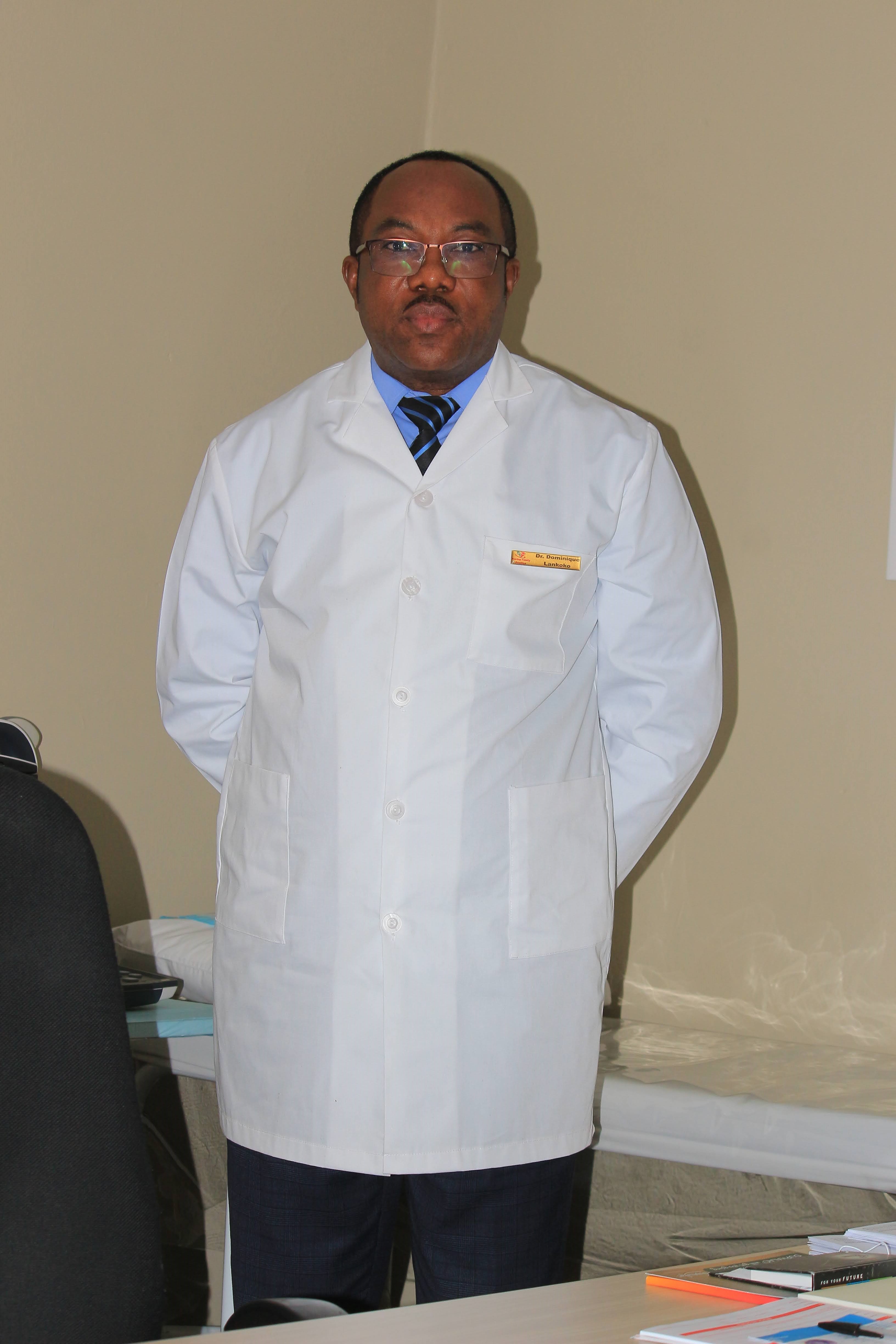 Dr. Lankoko standing in consultation room
