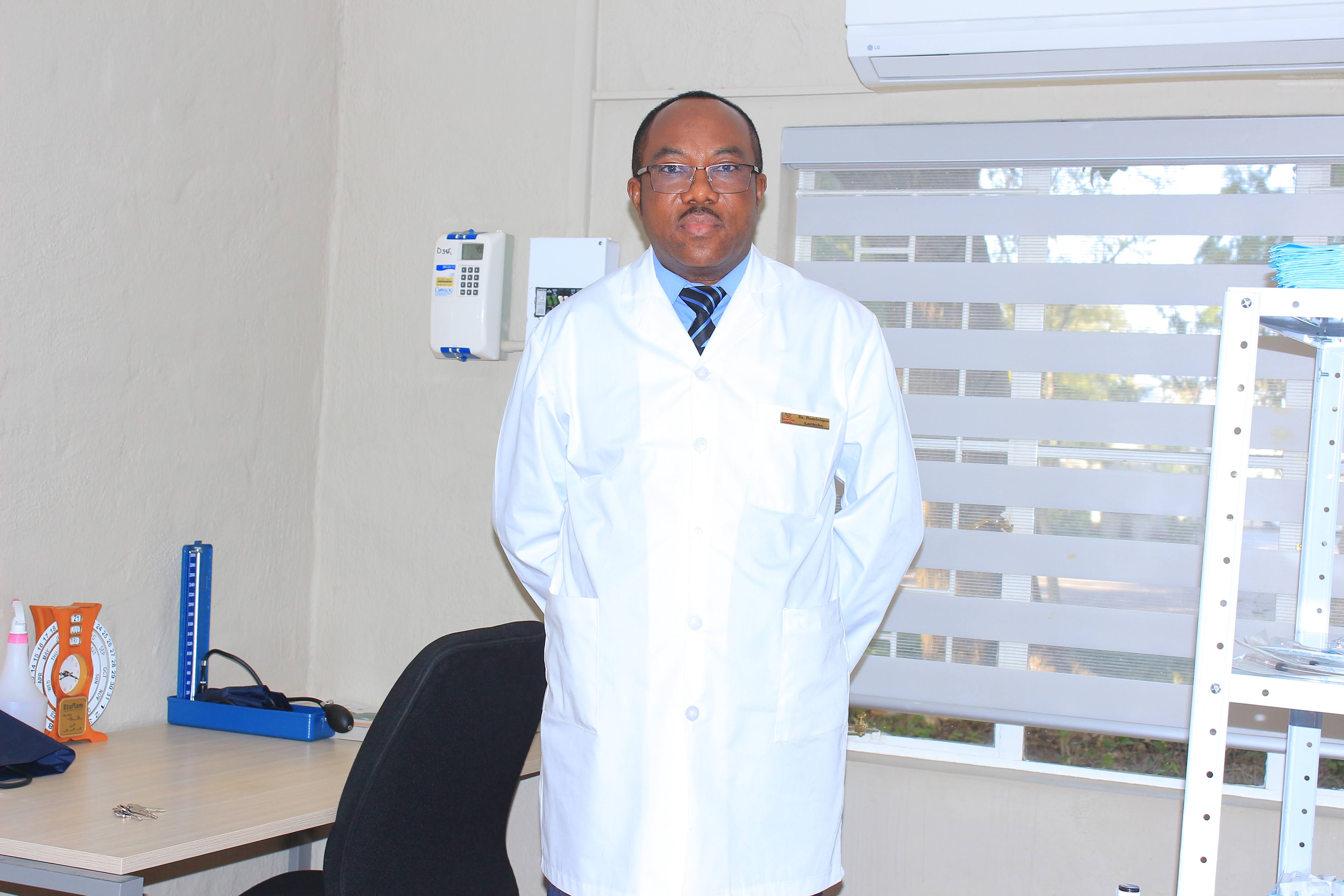 Doctor and staff standing together